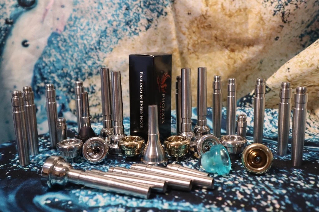 Phoenix Brass metal tops, backbores and complete mouthpieces arranged together